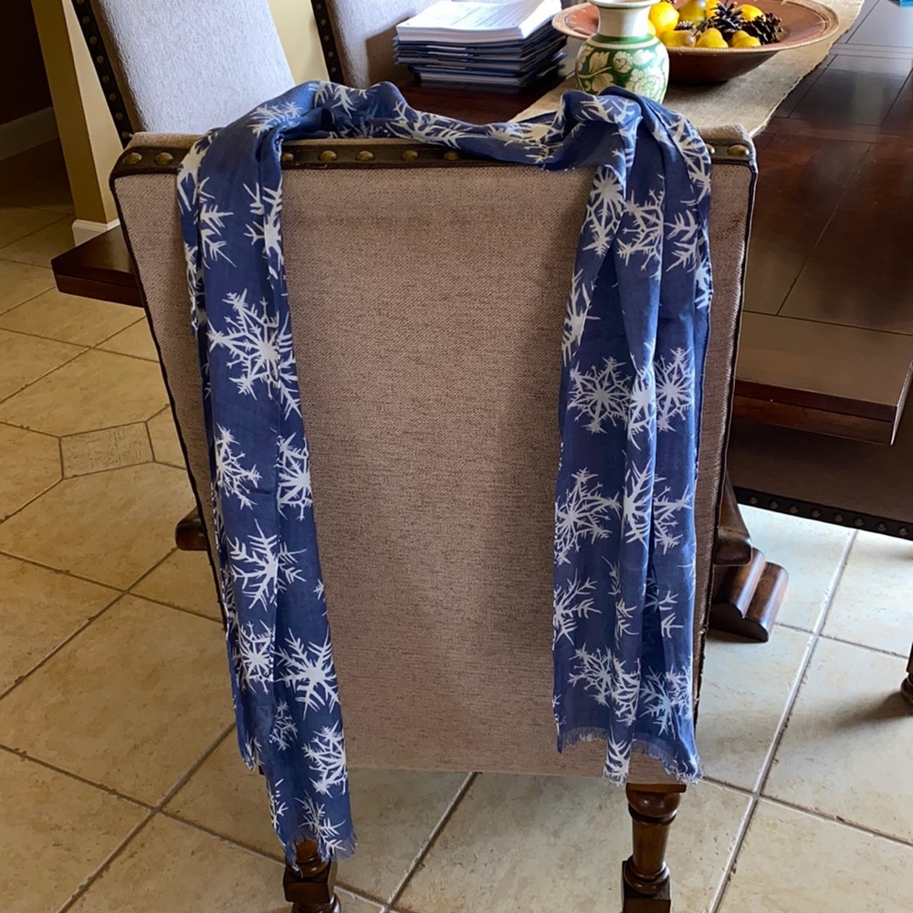 Light blue with white snowflakes scarf. Can wear loose or as wrapped as you want